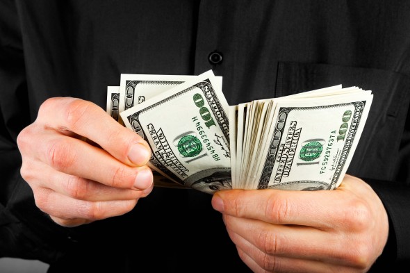 man counts money in hands dollar usa